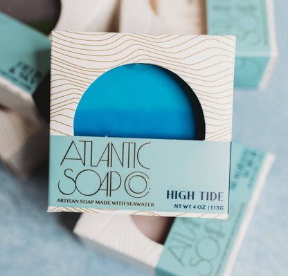 Blue soap bar in a packaging box with 'Atlantic Soap Co' branding on a light blue background.